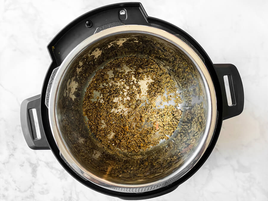 Spices being sautéed in the pressure cooker.
